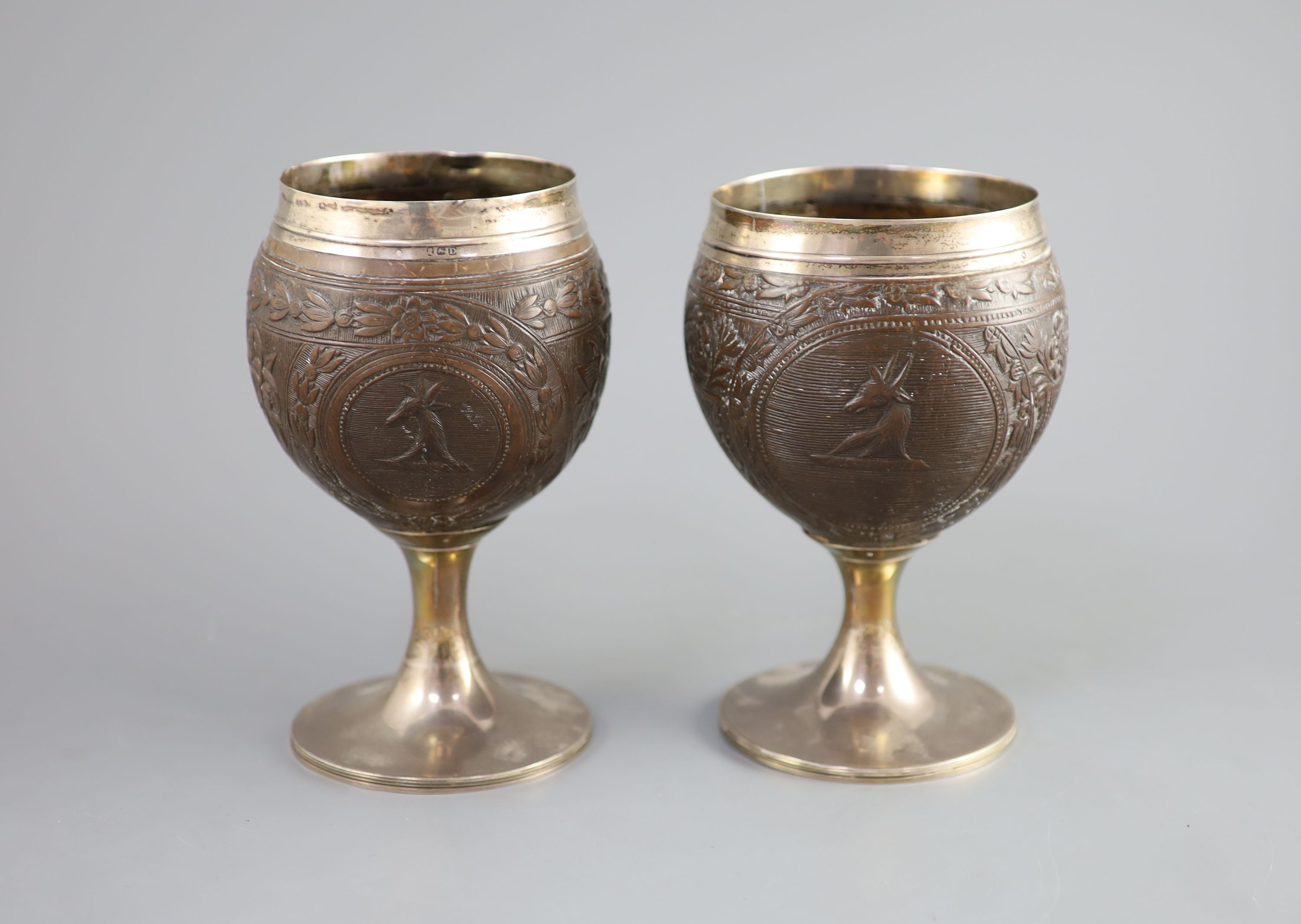 A pair of George III silver mounted coconut cups by Phipps & Robinson